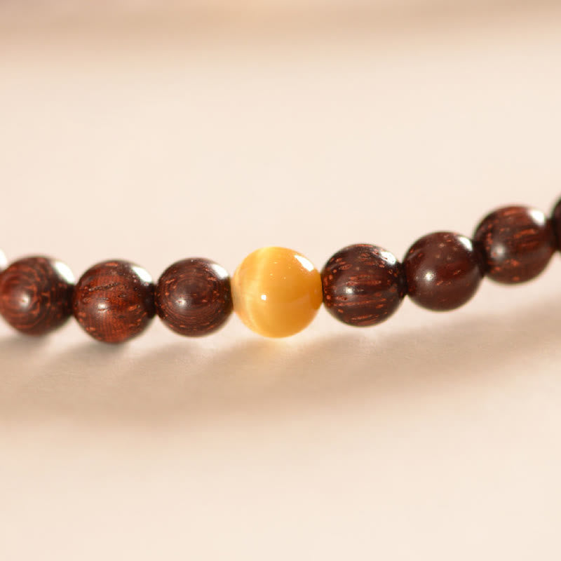 Sandelholz Armband mit goldenem Zentrum Stein braun glänzend