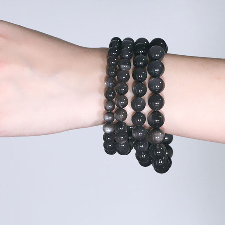 Schwarzes Obsidian Armband Mondstein Mond – Liebe elastisch am Handgelenk getragen