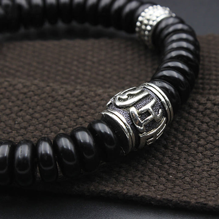 Schwarzes Om Mani Padme Hum Armband Energie mit Silber Perlen elegant
