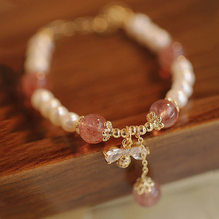 Armband Erdbeerquarz Perle – Heilung mit goldenem Charm elastisch