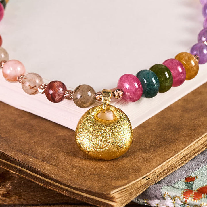 Schlüsselanhänger Fu Amethyst Super Seven goldener Anhänger bunte Perlen spirituell