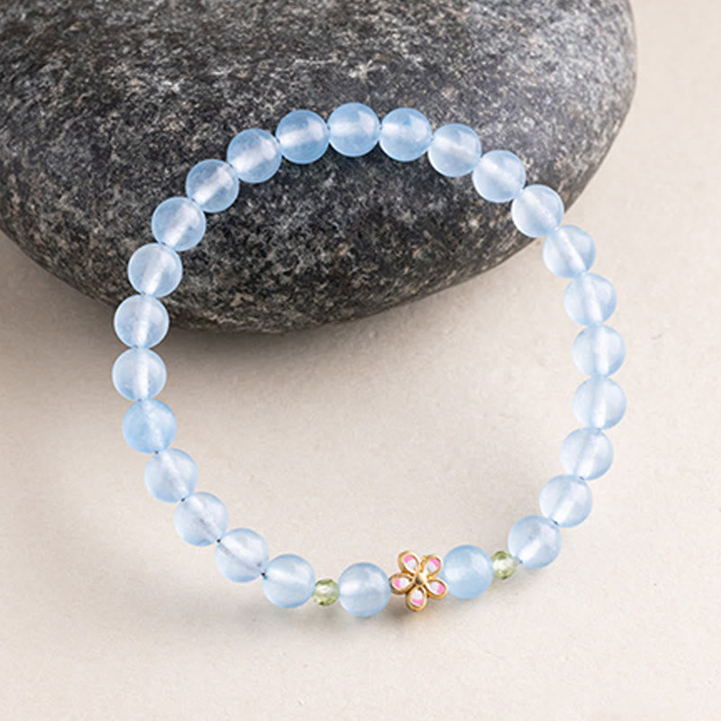 Armband Aquamarin Kupfer Blume Heilung blaue Perlen rosa Blüte Stein