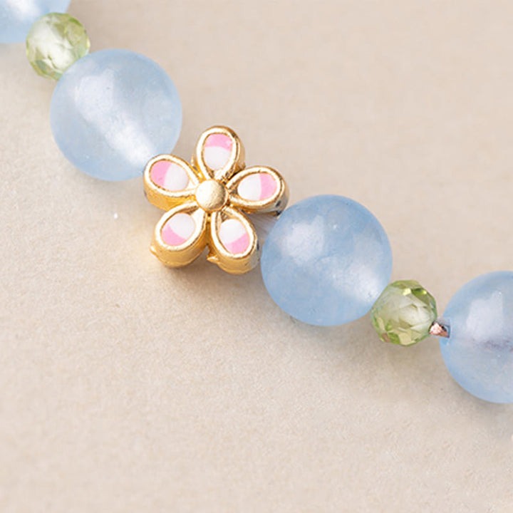 Armband Aquamarin Kupfer Blume Heilung blaue Perlen rosa Emaille Detail