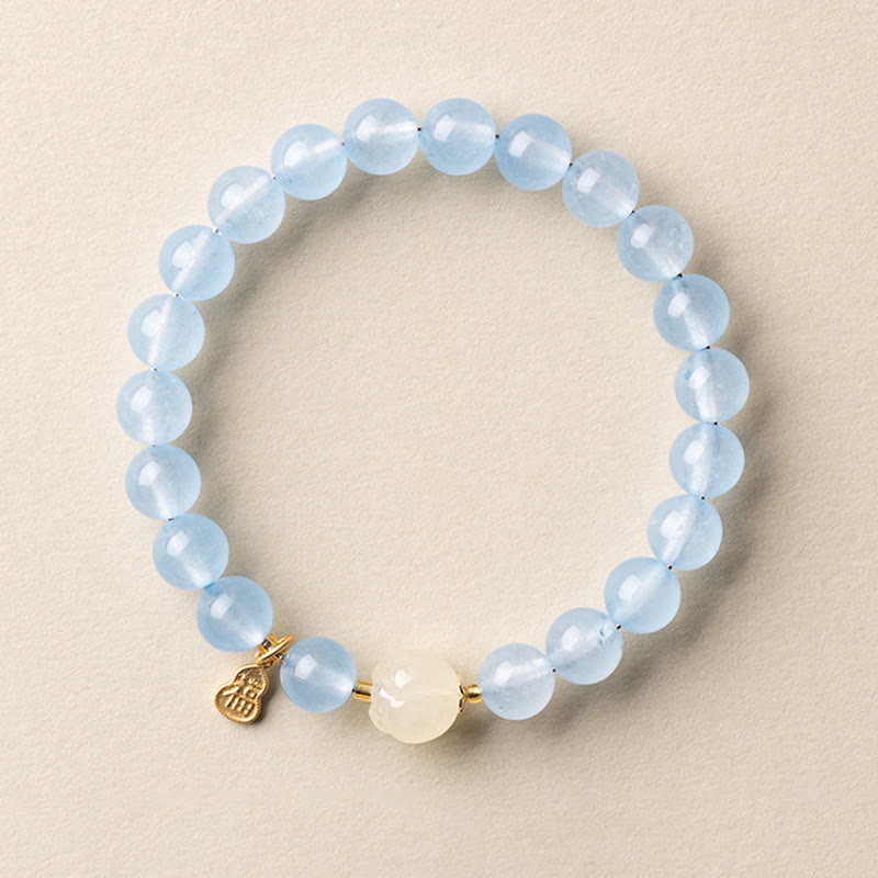 Armband Aquamarin Fu-Zeichen Glück Heilung blaue Perlen goldener Anhänger