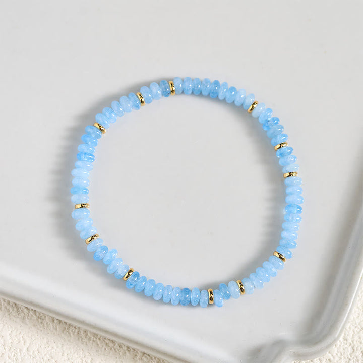 Armband Aquamarin Perle blau mit goldenen Akzenten Schmuck Heilstein