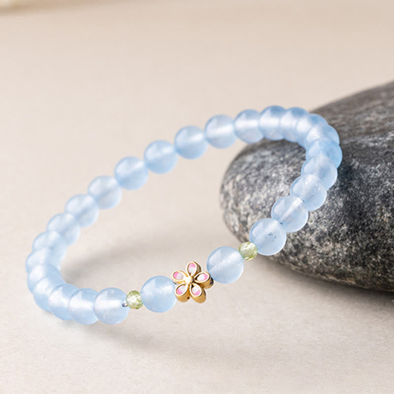 Armband Aquamarin Kupfer Blume Heilung Perlen rosa Blüte Stein Hintergrund