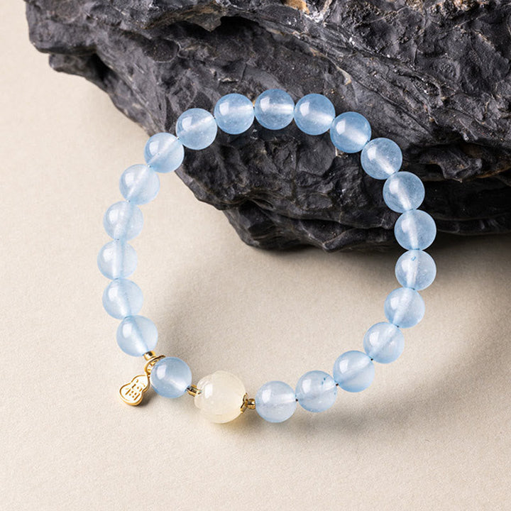Armband Aquamarin Fu-Zeichen Glück Heilung blaue Perlen goldener Anhänger Mondstein