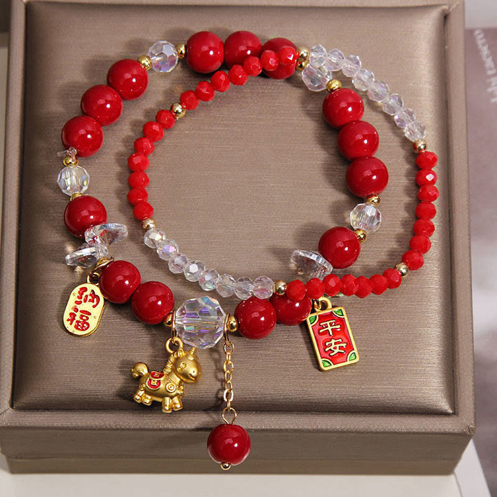 Armband Jahr Des Pferdes – Wohlstand rote Perlen goldenes Pferd Glücksanhänger