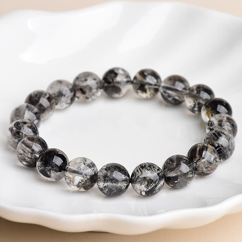 Armband Herkimer Diamant Schutz Meditation schwarze Perlen auf weißem Teller