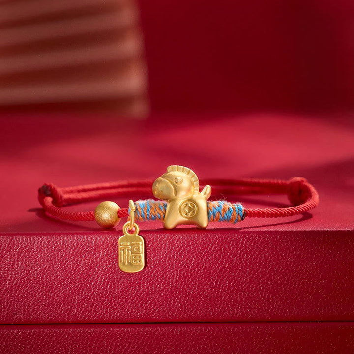 Armband Fu-Zeichen Glück Stärke rotes Seil goldenes Pferd Anhänger