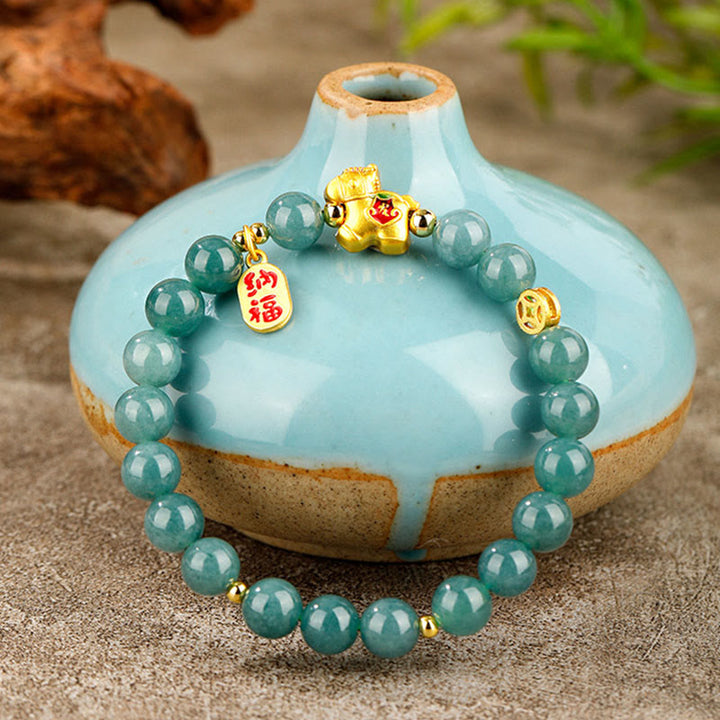 Armband Jade Fülle & Wohlstand Pixiu goldener Anhänger grüne Perlen Vase