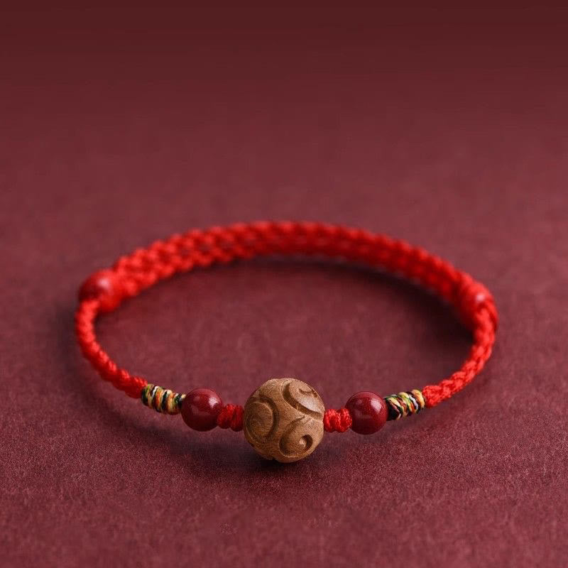 Armband Pfirsichholz Zinnober Glück rotes geflochtenes Band Schutz Handgelenk