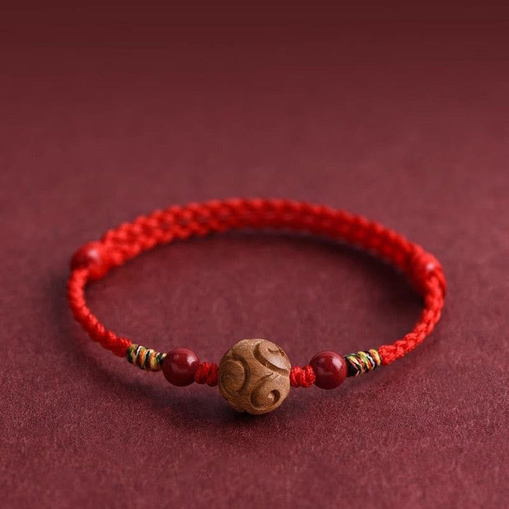 Armband Pfirsichholz Zinnober Glück rotes geflochtenes Band Schutz Handgelenk