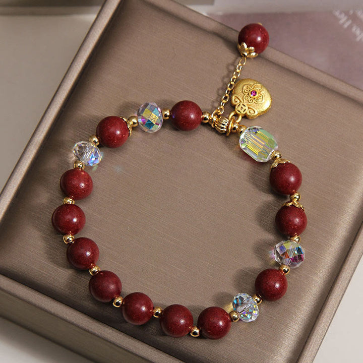 Armband Sandelholz – Glück & Heilung rote Perlen Kristalle goldenes Herz Schmuckbox