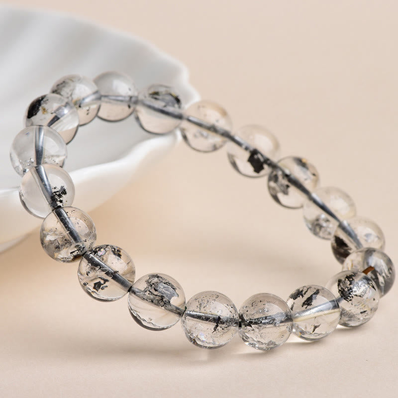 Armband Herkimer Diamant Schutz Meditation klare Perlen auf Schale präsentiert