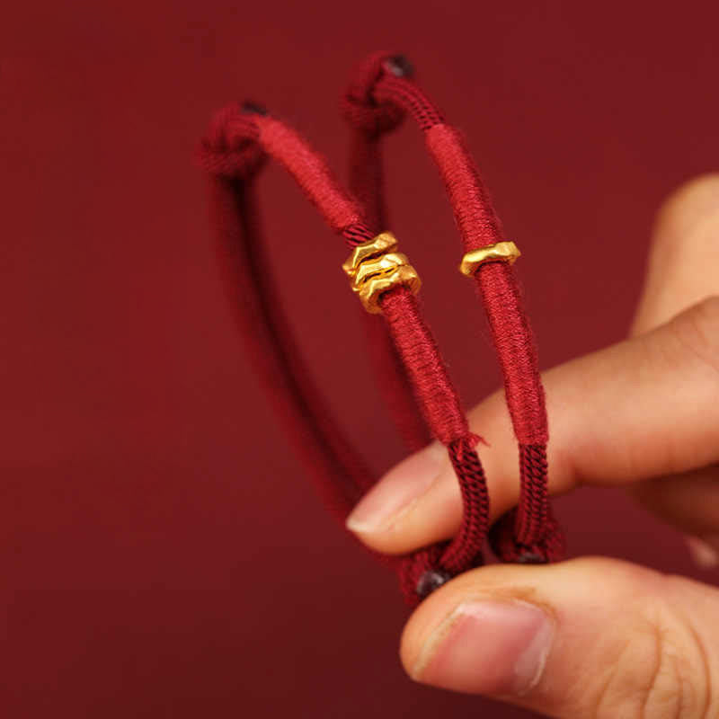 Armband 999 Gold Geflochten Rot – Glück, handgeknüpft am Handgelenk getragen