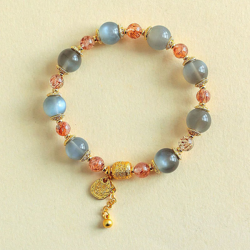 Armband Erdbeerquarz Mondstein Mond Heilung Positivität goldene Perlen Anhänger