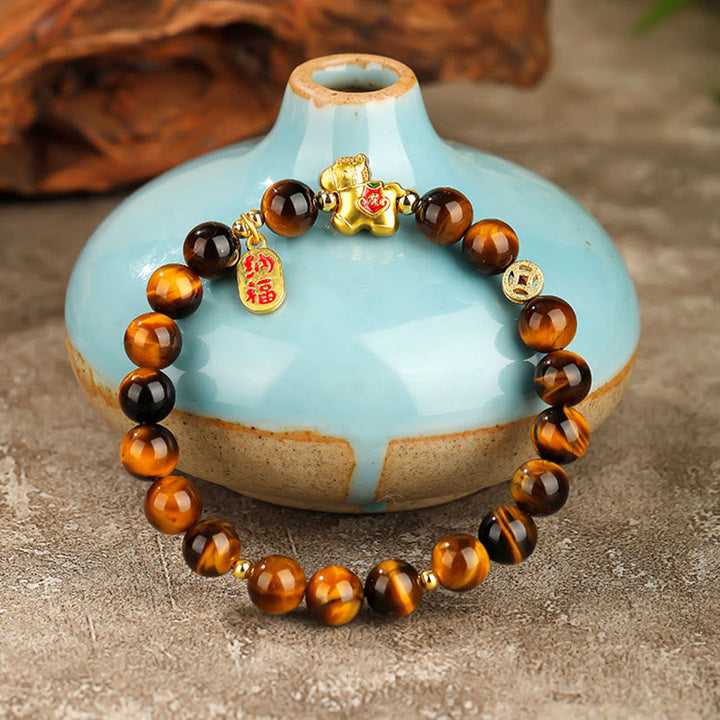 Armband Tigerauge Jahr Des Pferdes – Mut mit goldenem Pferd Anhänger