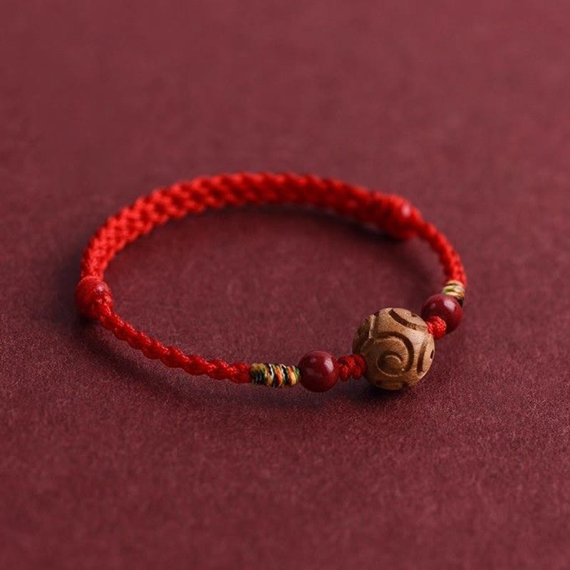 Armband Pfirsichholz Zinnober Glück geflochten rot Perlen Schutz Handgelenk