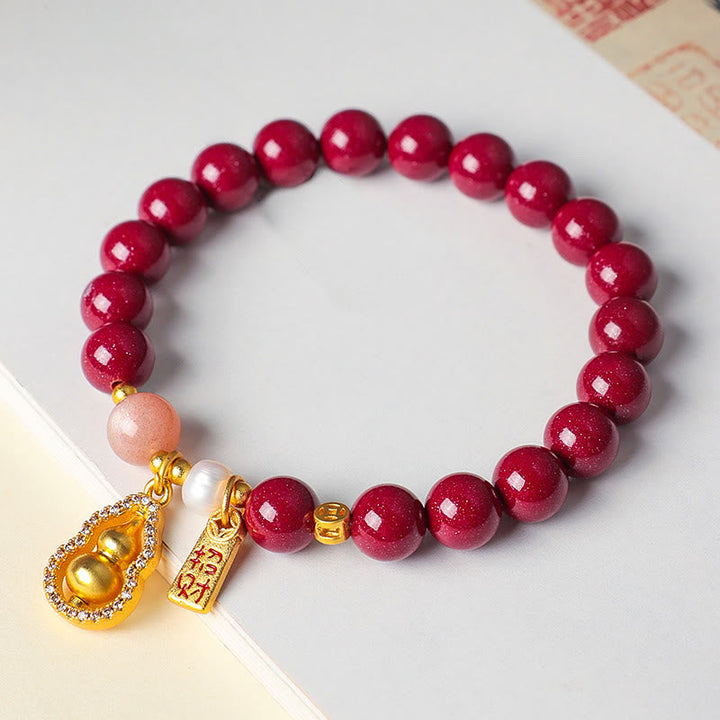 Armband Zinnober – Segen & Glück mit goldenem Kürbis Anhänger und Perle