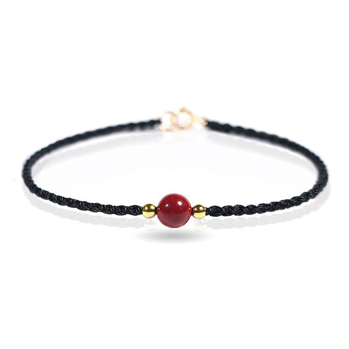 Armband Zinnober Rotes Band geflochten mit goldener Perle Glück Schutz Handgelenk