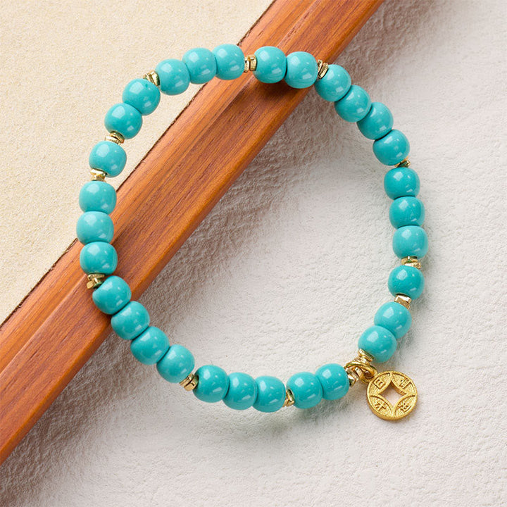 Armband Magnesit Kupferplattiertes Gold Buddha Kupfermünzen-Amulett türkis Perlen Schutz Glück