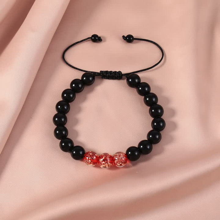 Armband Schwarzer Obsidian – Stärke mit roten Perlen elastisch
