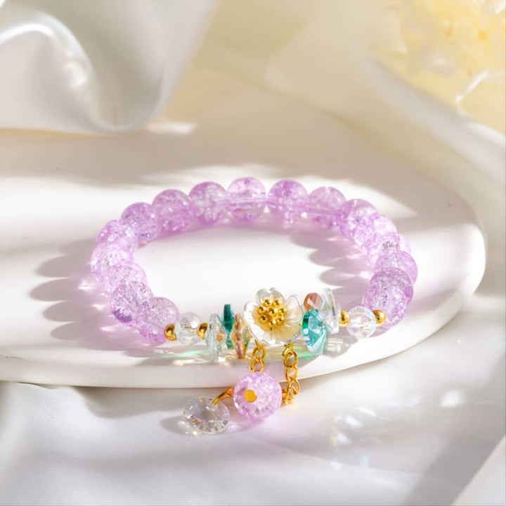 Armband Blume Glas lila Perlen Blütenanhänger elegantes Design
