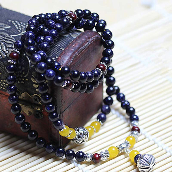 Mala – Wohlstand Armband dunkelblau gelb Perlen Naturstein elastisch.