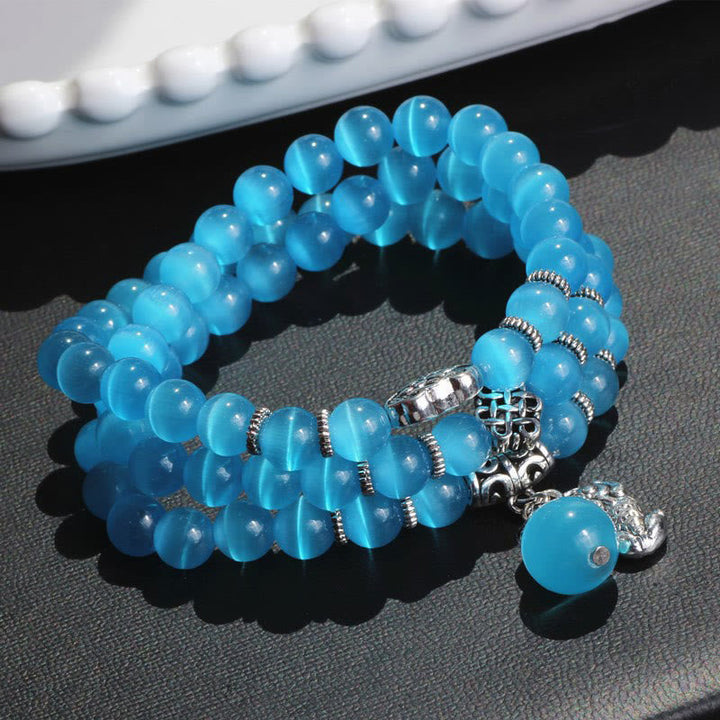 Armband Katzenauge PiXiu Dreifach hellblau Perlen Silber Charm elegant