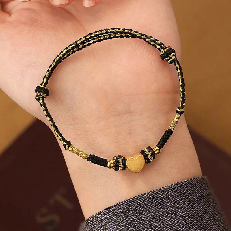 Armband – Glück & Liebe & Energie schwarzes Gold Herzanhänger Handgelenk