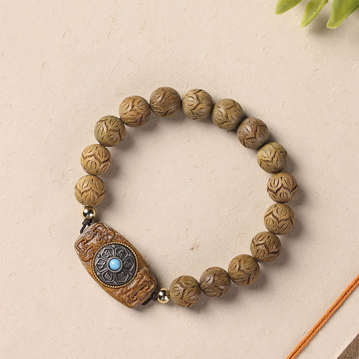 Armband Sandelholz Ebenholz Om Mani Padme Hum mit blauem Stein