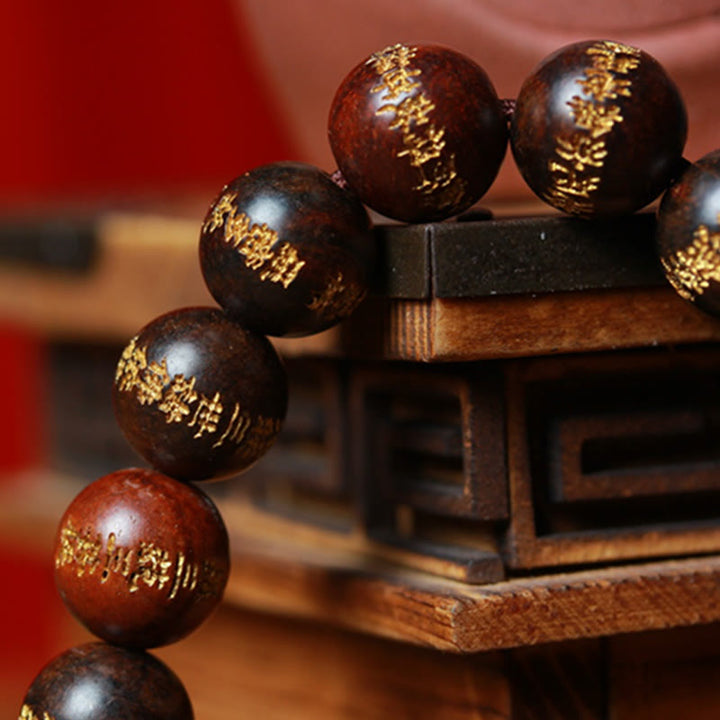 Armband Rosenholz Herzsutra mit goldenen Gravuren Perlen