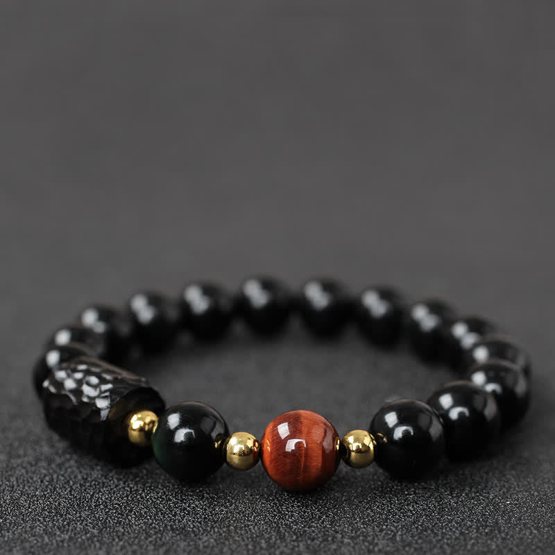 Schwarzer Obsidian Tigerauge Armband mit goldenen Akzenten elegantes Design.