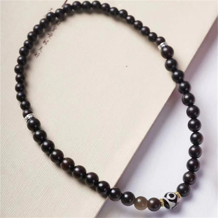 Armband Ebenholz Dzi – Balance & Schutz
