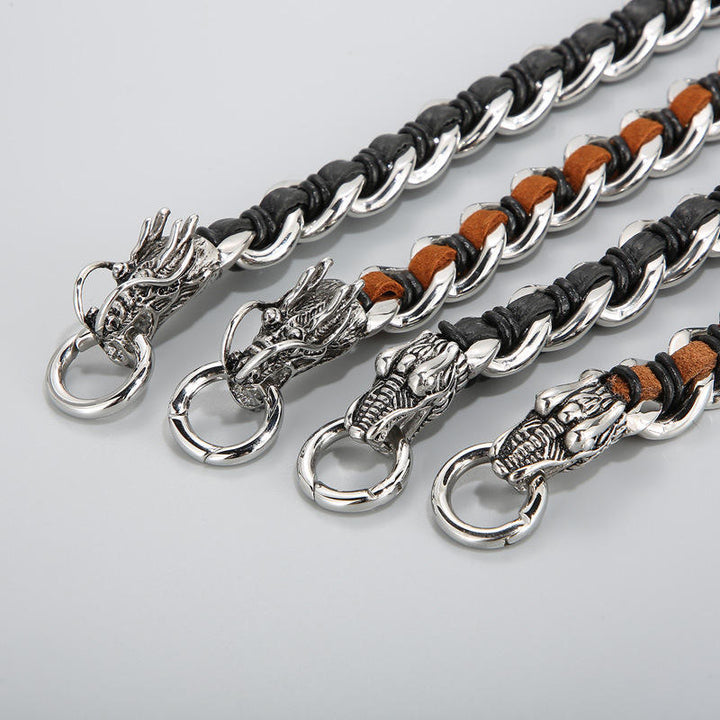 Vier Drachen Armbänder mit Silberverschlüssen und Lederdetails angeordnet.