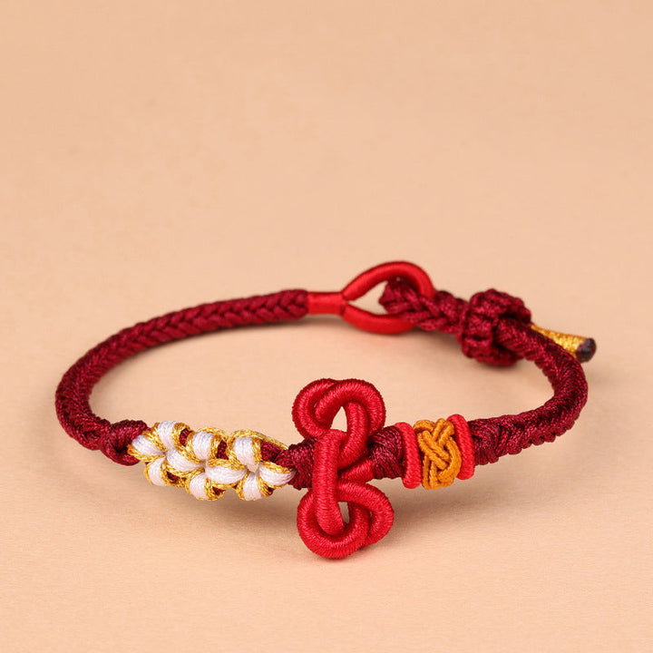 Rotes Armband – Glück & Stärke & Balance mit goldenen Blütenperlen