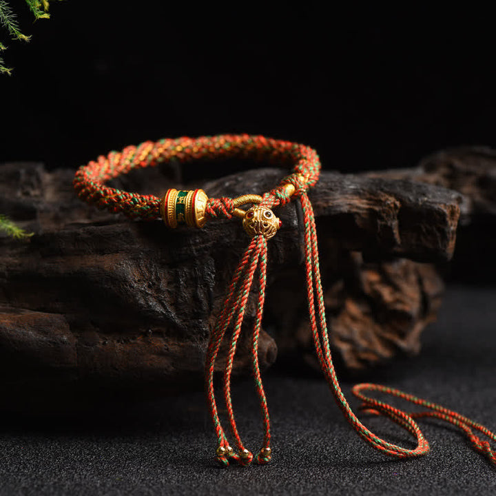 Tibetisches Gebetsrad Armband mit roten goldenen Perlen elegant.