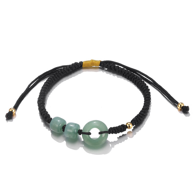 Armband Grüner Aventurin mit schwarzem Seil und Goldakzenten elegant präsentiert.