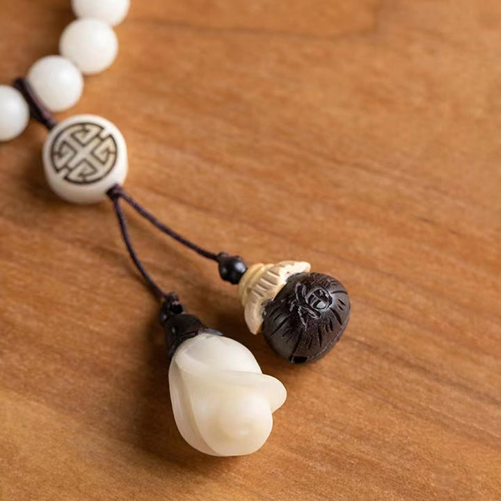 Armband Sandelholz Bodhi – Energie weiße Perlen schwarze Kordel Anhänger