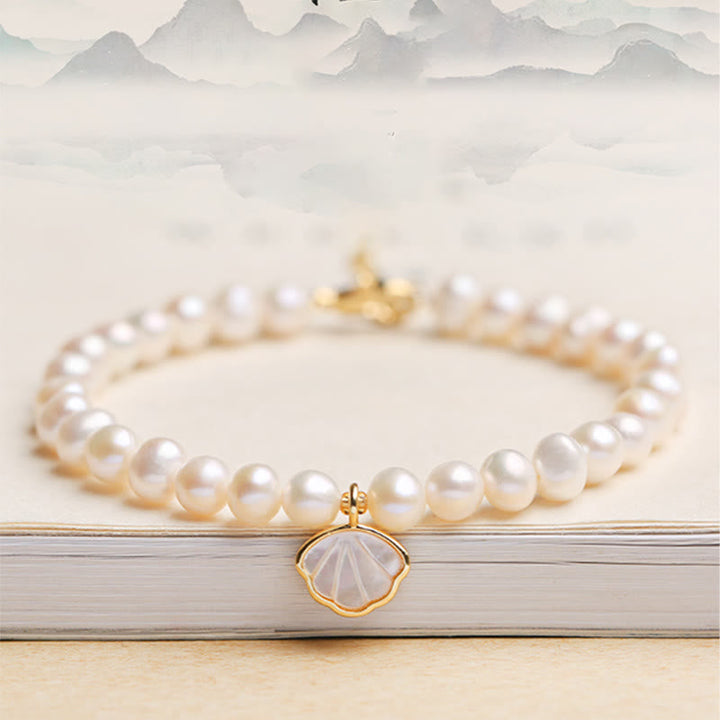 Armband Kristall Perle weiß mit Muschel Anhänger Gold elegant