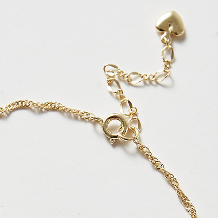 Goldkette Armband mit Herz Verschluss elegant minimalistisch Design.