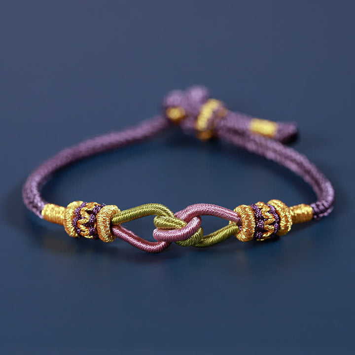 Armband Knotting Faith Stärke geflochten lila gold elegant Handgelenk getragen