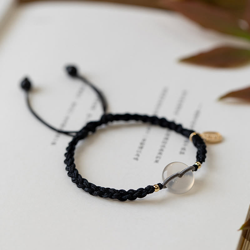 Armband – Frieden schwarzes geflochtenes Seil mit klarem Quarz Anhänger