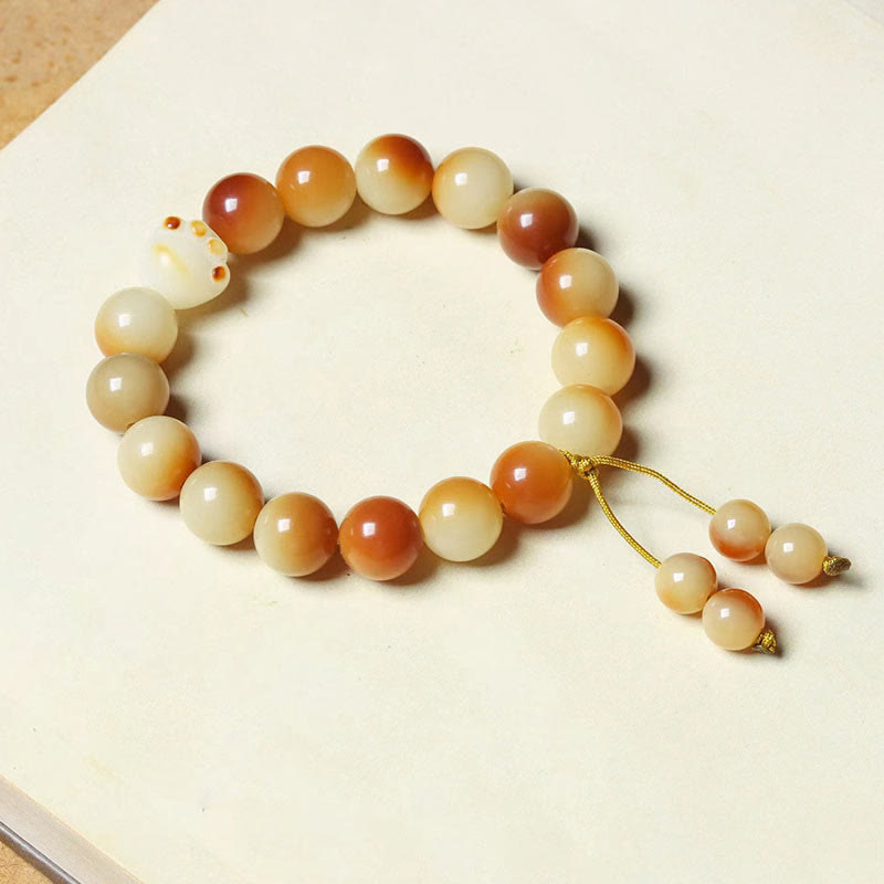 Bodhi Armband mit Perlen in Creme und Braun Naturstein elastisch.