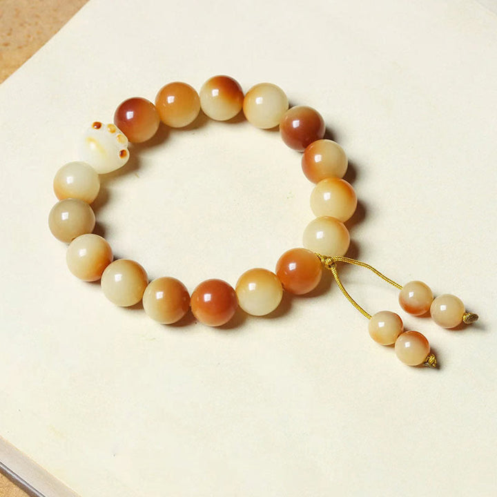 Bodhi Armband mit Perlen in Creme und Braun Naturstein elastisch.