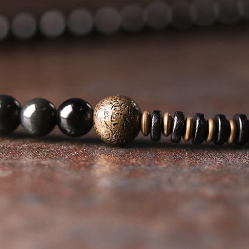 Armband Obsidian Kupfer schwarze Perlen goldene Akzente Naturstein