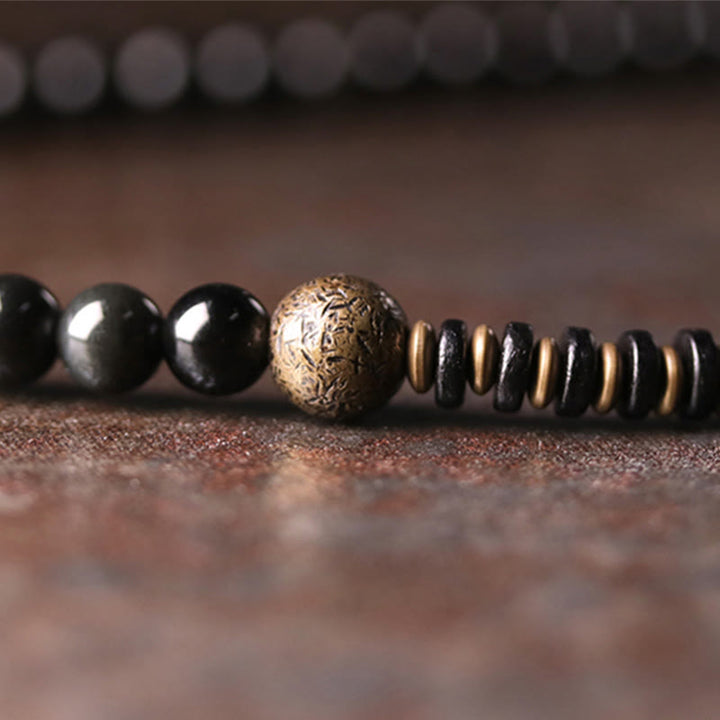 Armband Obsidian Kupfer schwarze Perlen goldene Akzente Naturstein