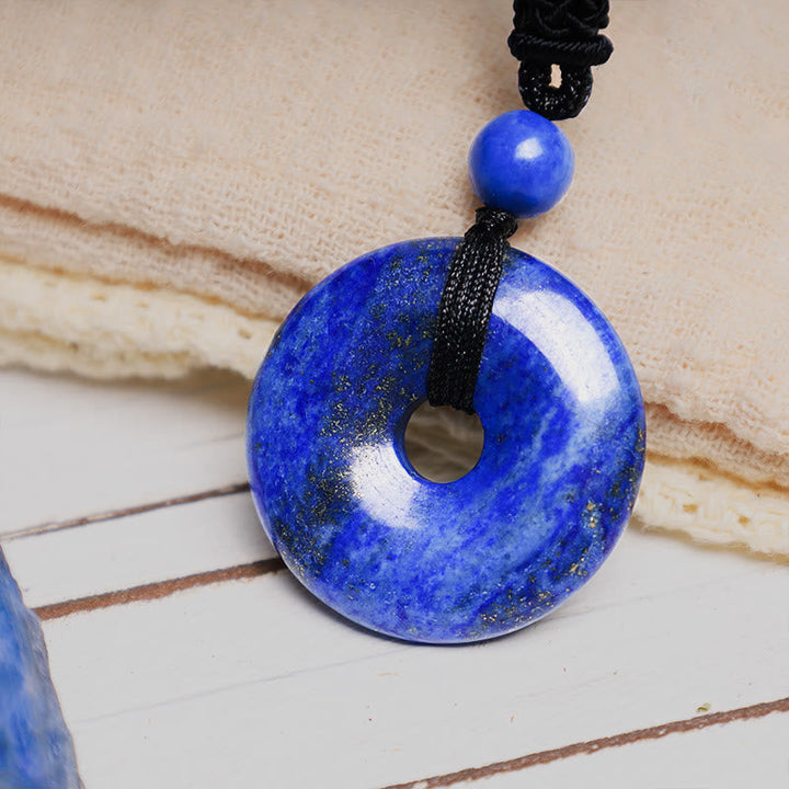 Lapislazuli Donut Kette Anhänger blau Naturstein schwarzes Band