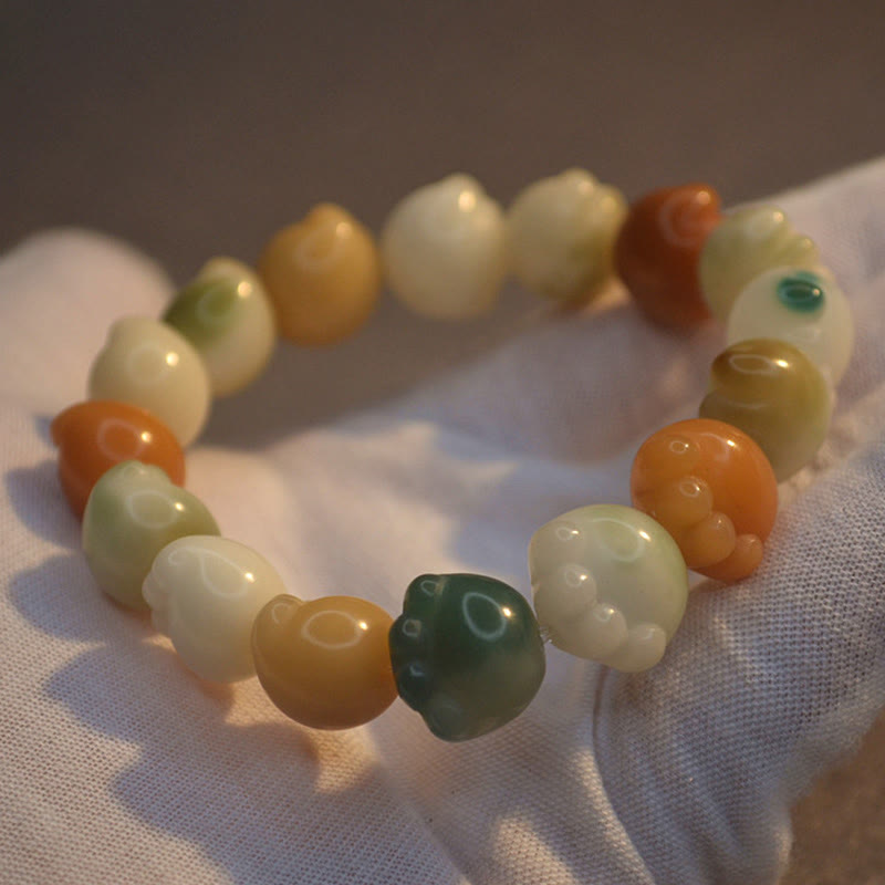 Armband mit Bodhi Perlen Natursteinen cremeweiß orange grün